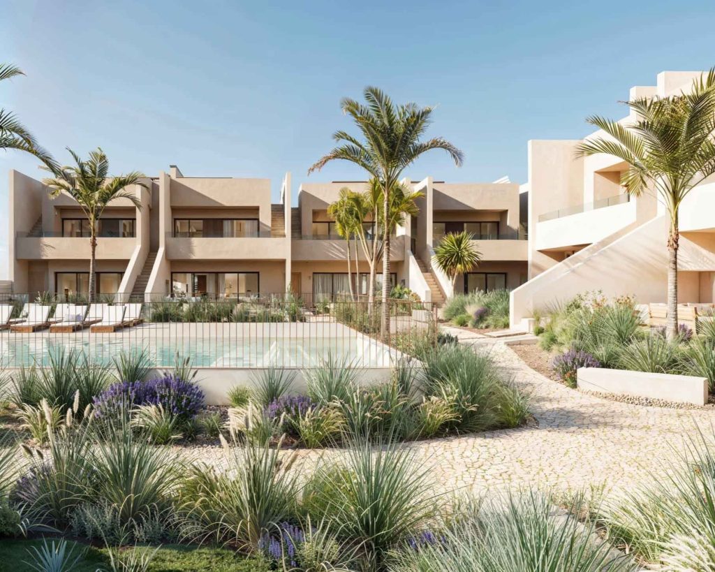Zona comunitaria de la promoción residencial Oasis Homes de Nítida arquitectos en Murcia, con piscina, jardín tropical y viviendas de volumen escalonado en acabado blanco